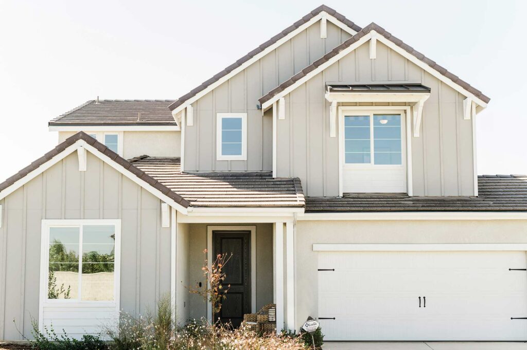 Exterior view of a Bonadelle Neighborhoods home in the Craftsman style. This two-story home features a two-car garage and peaked roof with classic Craftsman details.