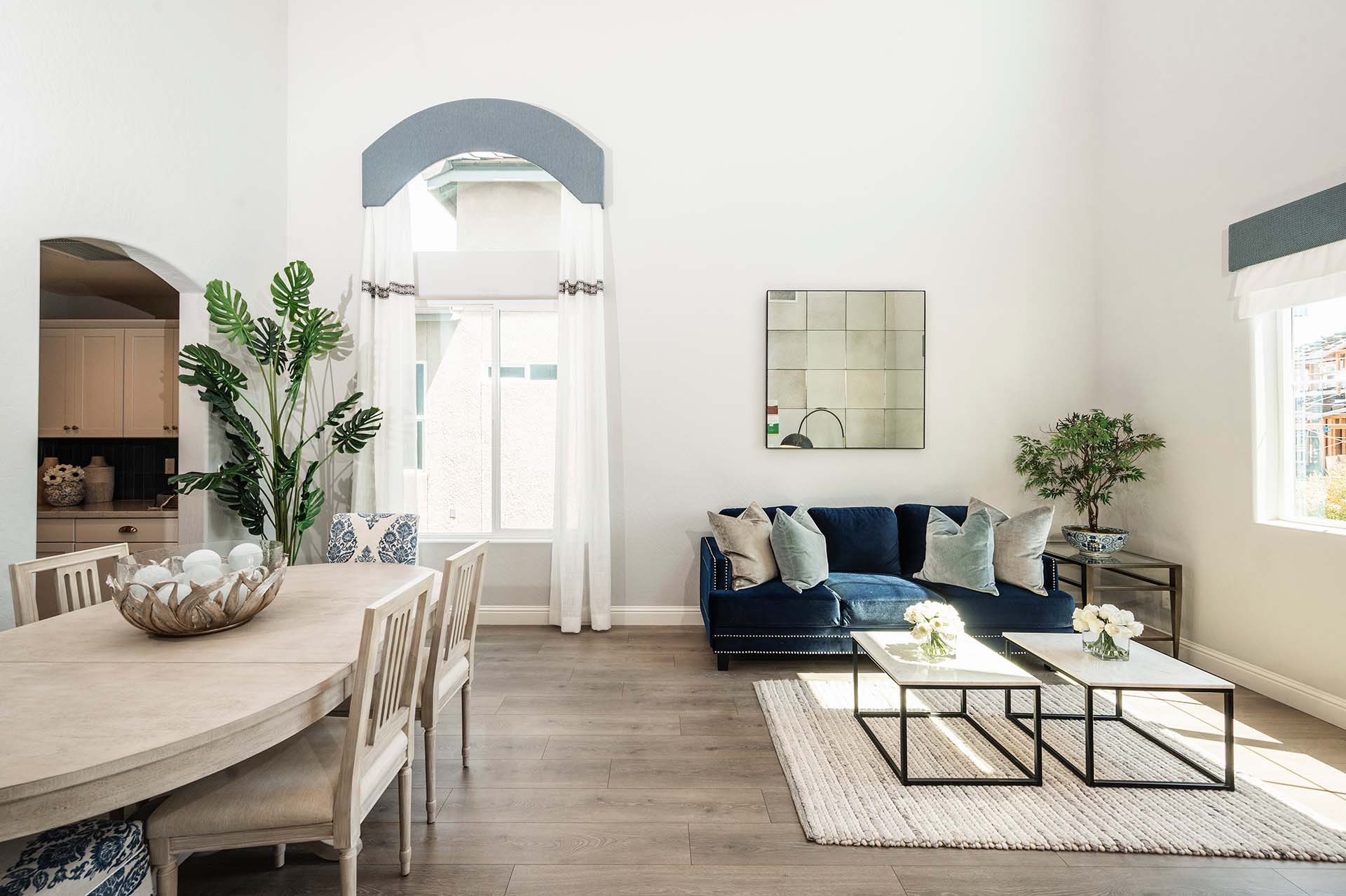 A Bonadelle Neighborhoods living room with wood flooring and abundant natural light.